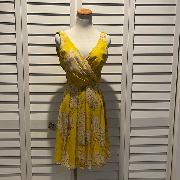 Trina Turk floral lined Dress in a beautiful yellow/ Tan printed fabric. - Picture 1 of 10